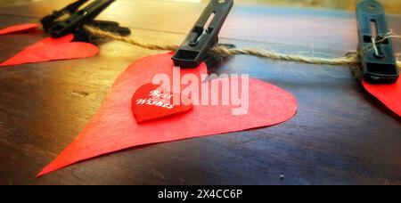Red valentine heat. Valentines day background. Valentines background with clipped red paper hearts on wood planks. Happy lovers day. valentines day concept. Happy valentines day. Stock Photo