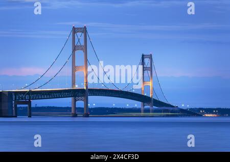 Lights on Mackinac Bridge at twilight, seen from Mackinaw City Michigan Stock Photo