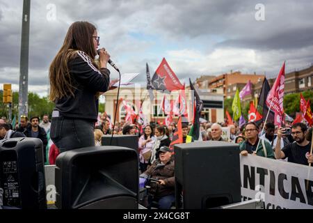 Barcelona, Spain. 01st May, 2024. A protester speaks during the demonstration. Thousands of people marched in Barcelona and Spain's main cities demanding better wages and working conditions on International Workers Day. Credit: SOPA Images Limited/Alamy Live News Stock Photo