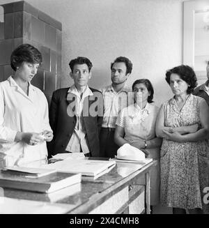 Socialist Republic of Romania in the 1970s. Employees of a state-owned enterprise in the doctor's office. Stock Photo