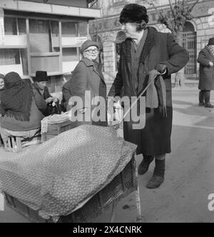 Socialist Republic of Romania in the 1970s. Elderly women out on the street to find and buy groceries. Stock Photo