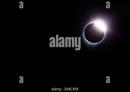 USA, Wyoming. Total solar eclipse. The 'Diamond Ring' effect is seen as the moon makes its final move over the sun. The ring is the sun's corona. Stock Photo