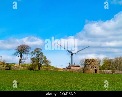 Senvion MM82/2050 wind turbines at Carsington Pasture in the Derbyshire Dales England UK with ruins of old windmill in foreground. Stock Photo