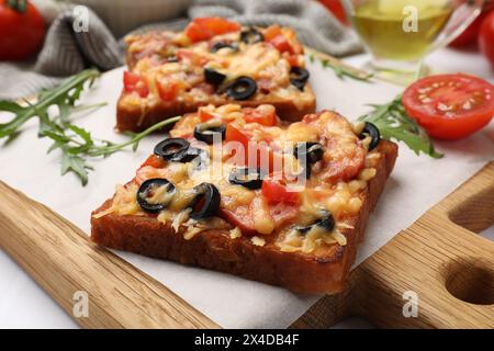 Tasty Pizza Toasts And Ingredients On White Tiled Table, Flat Lay Stock 