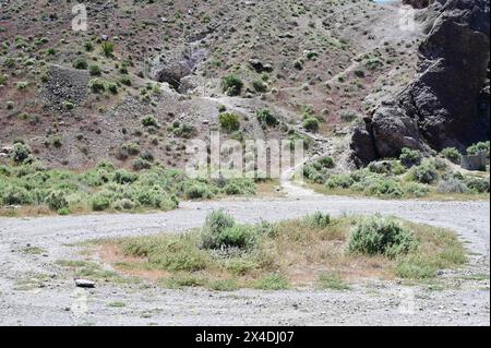 Entrance to Rhyolite Gold mine up a dirt track Stock Photo