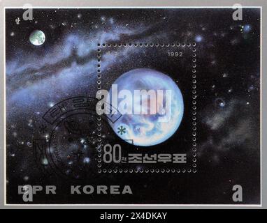 Souvenir Sheet with cancelled postage stamp printed by North Korea, that shows Earth, circa 1992. Stock Photo