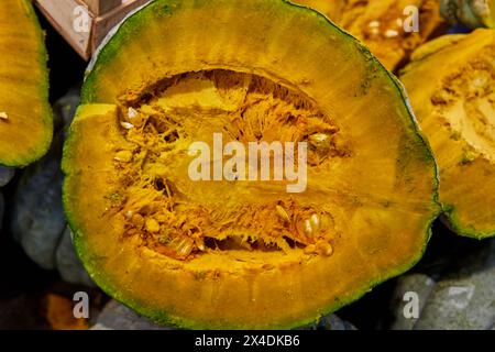 close-up of a half of a organic pumpkin half in a market in Salta, Argentina. front view shot Stock Photo