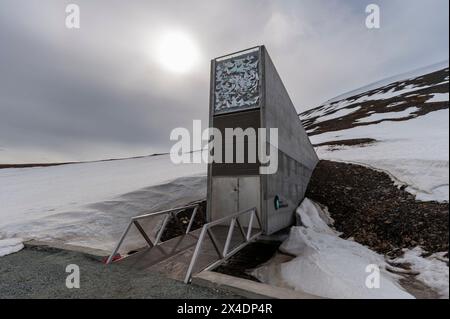 The entrance to the Svalbard Global Seed Vault built into a snow covered mountain. Longyearbyen, Spitsbergen Island, Svalbard, Norway. Stock Photo