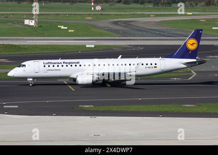 German Lufthansa Regional Embraer ERJ-190 with registration D-AECA on taxiway at Dusseldorf Airport Stock Photo