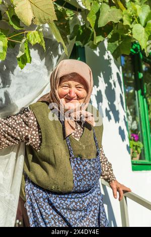 Romania, Transylvania, Vrancea county, Coltesti. Elderly Romanian woman portraying village life. (Editorial Use Only) Stock Photo