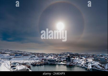 A solar halo, an phenomenon caused by light interacting with ice crystals in the atmosphere. Ilulissat, Greenland. Stock Photo