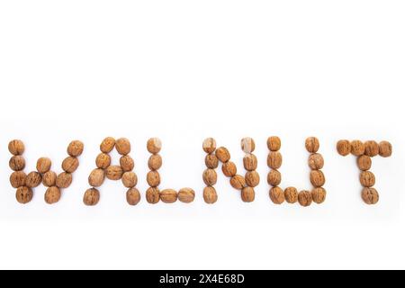 Walnut lettering from walnuts on a white background Stock Photo