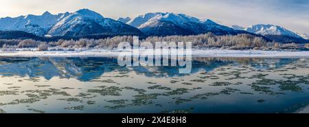 USA, Alaska, Chilkat Bald Eagle Preserve. Panoramic of mountains reflecting in river. Stock Photo
