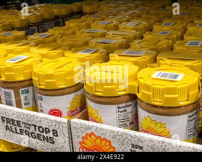 BAXTER, MN - 3 FEB 2021: Jars of SunButter spread, made from sunflower seeds, on display in store. Stock Photo
