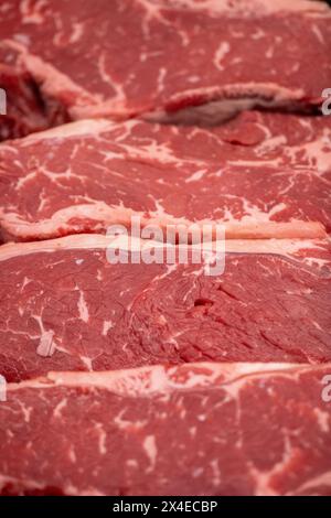 Fresh NY Strips at a butcher Stock Photo