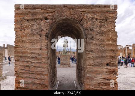 Pompeii forum. The statue of the Centaur seen through the arch of Augustus, Forum of Pompeii roman ruins, ancient civilization, Pompeii Italy Stock Photo