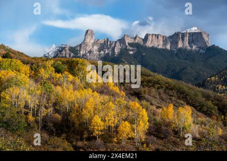 USA, Colorado, Uncompahgre National Forest. Sunset on aspens and mountain rock formations. Stock Photo