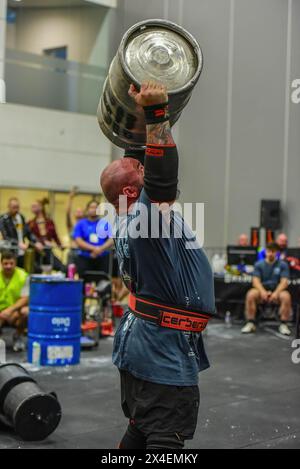 Strongman Matthew Chessum is seen in action with a keg at 2024 Oceania ...