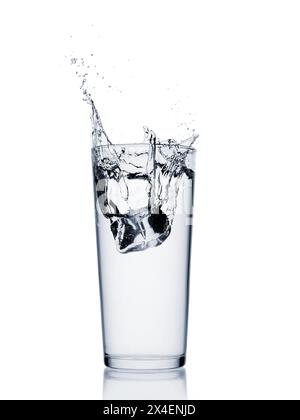 Water splash with ice cube in a glass isolated on white background Stock Photo