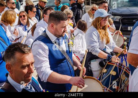 Blue Ribbon drummers parading in the streets at the 'Obby 'Oss festival, a traditional annual May Day folk event in Padstow, Cornwall Stock Photo