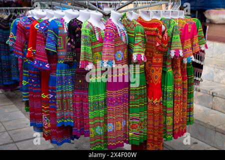 Colourful traditional clothing for sale at Bac Ha Market in Lao Cai Province, Vietnam Stock Photo