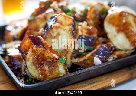 A delicious Chinese dish, deep fried eggplant stuffed with meat Stock Photo