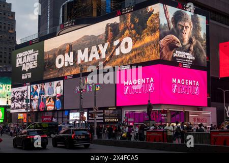 advertisement for Planet of the Apes release date, Times Square, Manhattan, Broadway, at dusk, New York city, USA Stock Photo