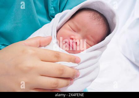 Happy Mother and Newborn Baby after labor at the hospital Stock Photo