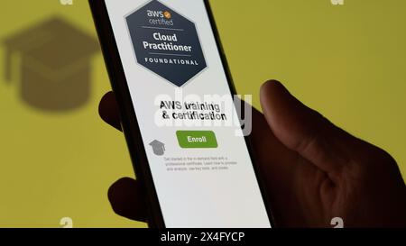 AWS enrollment, Student enrolls to aws certification program on a phone, upskilling certification on AWS cloud by e-learning Stock Photo