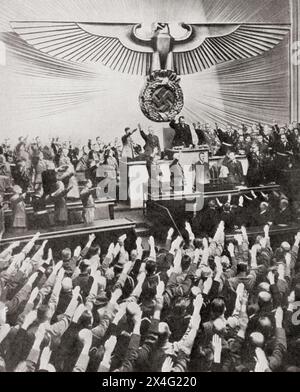 Hitler delivering his 'peace' speech in the Reichstag, 6 October 1939.  Adolf Hitler, 1889 – 1945. German politician, demagogue, Pan-German revolutionary, leader of the Nazi Party, Chancellor of Germany, and Führer of Nazi Germany from 1934 to 1945.  From The War in Pictures, First Year. Stock Photo