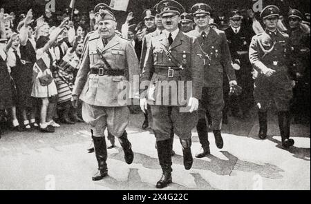 EDITORIAL The meeting of Hitler and Mussolini in Munich, 18 June, 1940.  Adolf Hitler, 1889 – 1945. German politician, demagogue, Pan-German revolutionary, leader of the Nazi Party, Chancellor of Germany, and Führer of Nazi Germany from 1934 to 1945.  Benito Amilcare Andrea Mussolini, 1883 – 1945. Italian dictator, journalist, founder and leader of the National Fascist Party (PNF), and Prime Minister of Italy. From The War in Pictures, First Year. Stock Photo