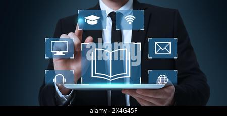 Webinar, banner design. Man using virtual screen over tablet on dark background, closeup Stock Photo