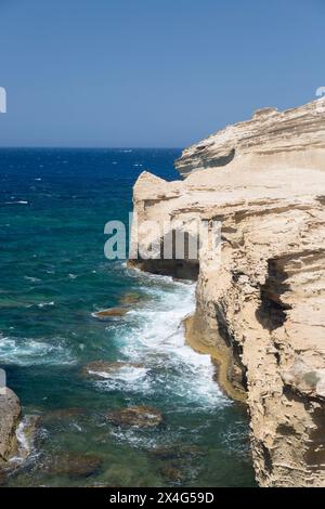 Bonifacio, Corse-du-Sud, Corsica, France. Rough seas battering the rugged limestone cliffs of Capo Pertusato. Stock Photo