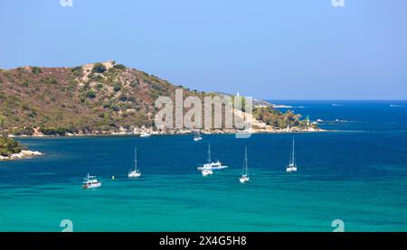 Saint-Florent, Haute-Corse, Corsica, France. View over the Gulf of Saint-Florent to the Fornali lighthouse and watchtower, Punta Mortella beyond. Stock Photo