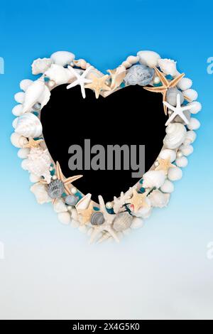 Seashell abstract heart shape frame with pearls and sea glass on blue white gradient background. Decorative nature design with tropical varieties. Stock Photo