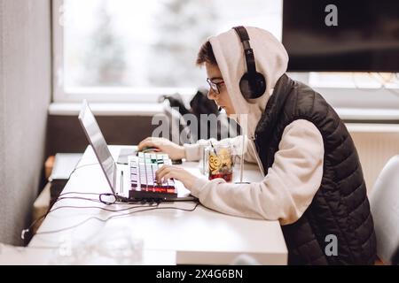 Chisinau, Moldova, October 30 2022: Teenager working at laptop Stock Photo