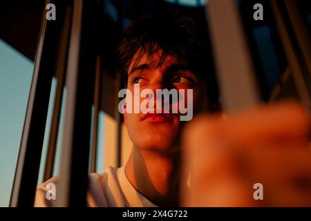 Portrait of young person in sunset light Stock Photo
