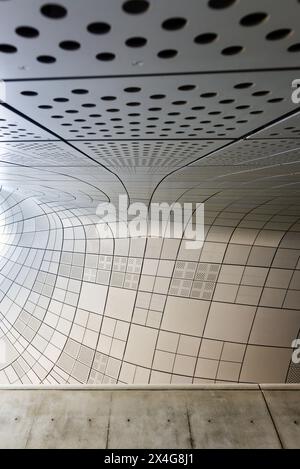 A white wall with a black and white design of squares and circles Stock Photo