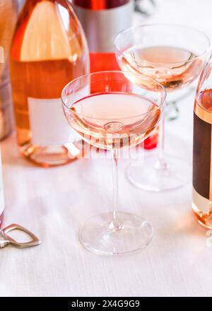 Two vintage shaped coupe glasses filled with rose wine Stock Photo