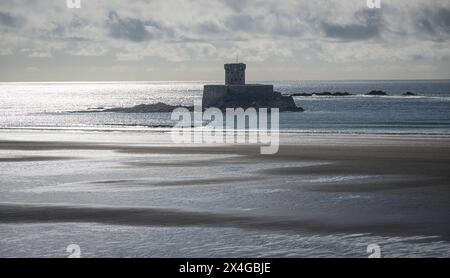 The Napoleonic era fortification of La Rocco Tower (or Fort Gordon) in St Ouen's Bay on the island of Jersey, Channel Islands Stock Photo