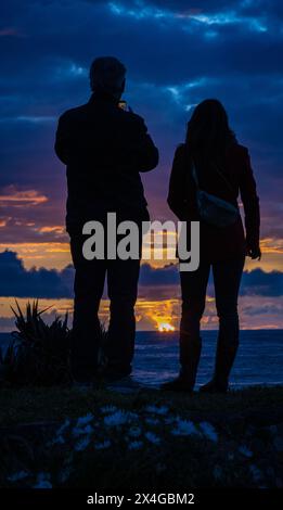 Watching the sunset on St Ouen's Bay on the island of Jersey, Channel Islands Stock Photo