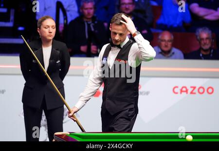 David Gilbert reacts during their semi-final match against Kyren Wilson (not pictured) on day fourteen of the 2024 Cazoo World Snooker Championship at the Crucible Theatre, Sheffield. Picture date: Friday May 3, 2024. Stock Photo