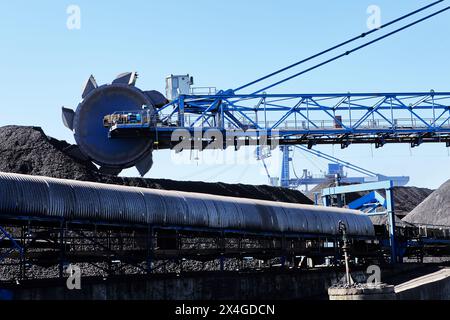 Stacker reclaimer machines to stack and store coal in stockpiles and stockyards and to reclaim materials when needed. Stock Photo