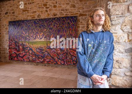 Haddington, United Kingdom. 03 May, 2024 Pictured: Artist, Joe Grieve with his large scale work The Other Side. Colstoun Arts is a new venture in Colstoun House in Haddington, outside Edinburgh. It is partly about diversification and new ways to sustain a country house, and partly about starting the journey to their vision – to become a national museum for landscape art. The first exhibition at the venue, The Other Side, features large-scale works by Landscape Painter, Joe Grieve. Credit: Rich Dyson/Alamy Live News Stock Photo