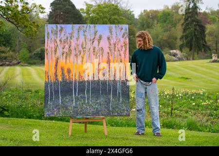 Haddington, Scotland, UK. 3rd  May 2024. Landscape artist Joe Grieve displays his paintings at Colstoun House near Haddington. His exhibition marks the opening of the first exhibition of Colstoun Arts which a new venture, partly about diversification and new ways to sustain a country house, and partly about starting the journey to their vision – to become a national museum for landscape art. Pic Artist Joe Grieve with painting End of the Road.    Iain Masterton/Alamy Live News Stock Photo