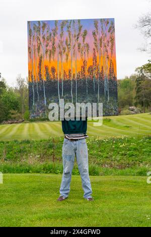 Haddington, Scotland, UK. 3rd  May 2024. Landscape artist Joe Grieve displays his paintings at Colstoun House near Haddington. His exhibition marks the opening of the first exhibition of Colstoun Arts which a new venture, partly about diversification and new ways to sustain a country house, and partly about starting the journey to their vision – to become a national museum for landscape art. Pic Artist Joe Grieve with painting End of the Road.    Iain Masterton/Alamy Live News Stock Photo