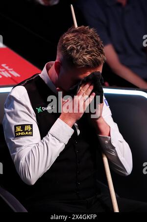Kyren Wilson reacts during their semi-final match against David Gilbert (not pictured) on day fourteen of the 2024 Cazoo World Snooker Championship at the Crucible Theatre, Sheffield. Picture date: Friday May 3, 2024. Stock Photo
