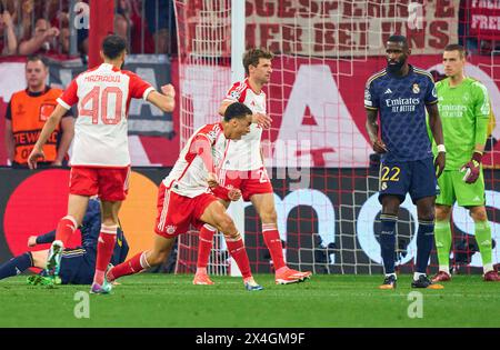 Jamal MUSIALA, FCB 42 at the penalty foul for 2-1 with Thomas MUELLER, MÜLLER, FCB 25 Antonio Rüdiger, Ruediger, Real Madrid  22  in the semi final match   FC BAYERN MUENCHEN - REAL MADRID 2-2 of football UEFA Champions League in season 2023/2024 in Munich, Apr 30, 2024.  Halbfinale,, FCB, München Photographer: ddp images / star-images Stock Photo