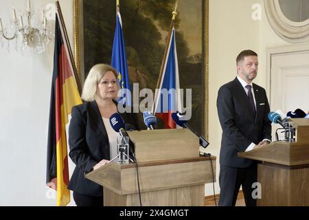 Prag, Czech Republic. 03rd May, 2024. Federal Minister of the Interior Nancy Faeser (l) speaks alongside Czech Interior Minister Vit Rakusan during a press statement at the Embassy of the Federal Republic of Germany in Prague on the Russian cyber attack on the SPD last year. (Replay with modified image section) Credit: Michael Heitmann/dpa/Alamy Live News Stock Photo