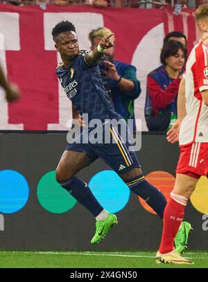 Vinicius Junior, Real Madrid 7   scores, shoots goal , Tor, Treffer, Torschuss, 0-1 against Manuel NEUER, goalkeeper FCB 1 , celebrates his goal, happy, laugh, celebration,  in the semi final match   FC BAYERN MUENCHEN - REAL MADRID 2-2 of football UEFA Champions League in season 2023/2024 in Munich, Apr 30, 2024.  Halbfinale,, FCB, Muenchen Photographer: ddp images / star-images Stock Photo